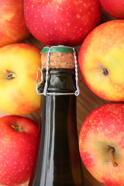 Bottle of cider and apples  Product of France stock photo