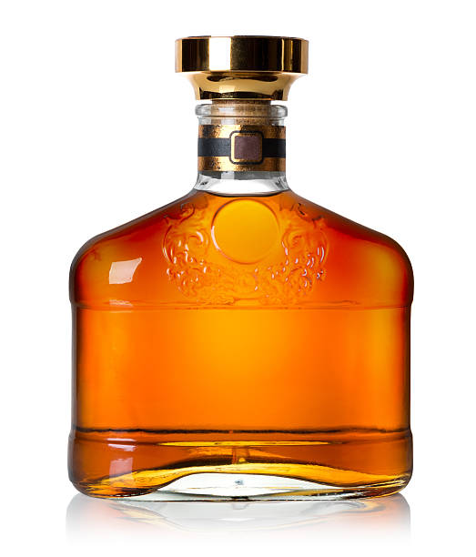 Bottle of cognac Bottle of cognac isolated on a white background rum stock pictures, royalty-free photos & images
