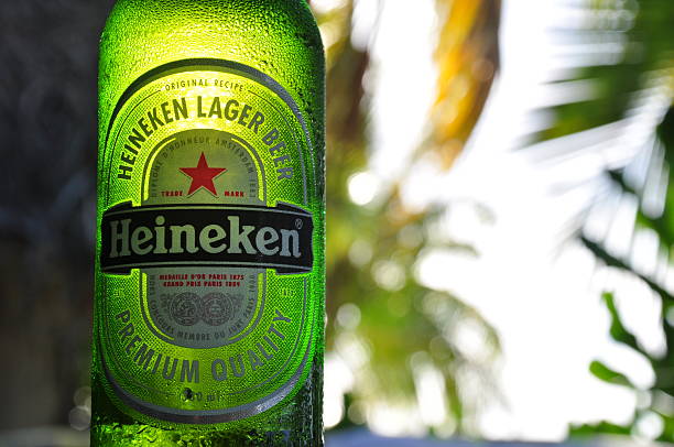 Bottle of Heineken beer in the sunlight stock photo