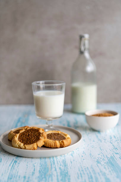 Bottle of milk and chocolate chip cookies stock photo