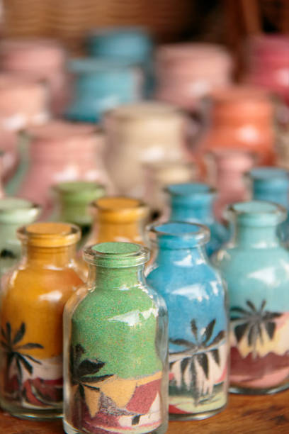 Bottles of coloured sands stock photo