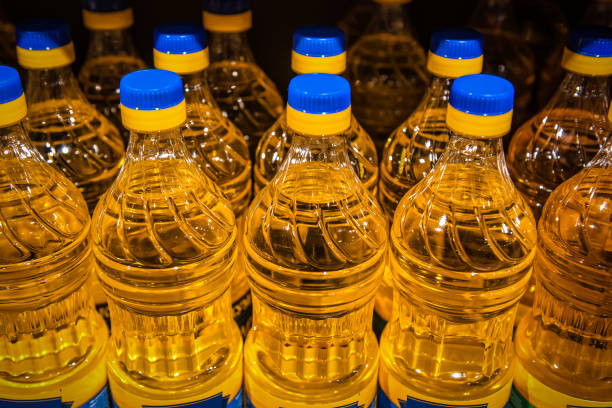 bottles of oil on supermarket stock photo