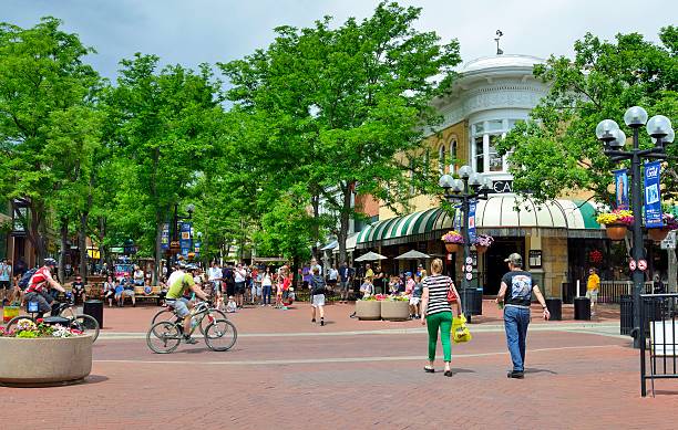 Boulder Colorado Boulder, Colorado, USA - June 16, 2013: Typical street scene with a variety of people in the shopping district of Boulder with colorful and quaint shops and restaurants. boulder colorado stock pictures, royalty-free photos & images