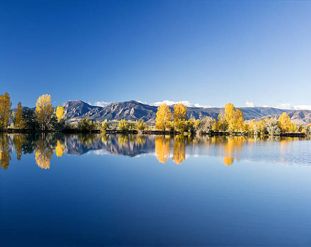Boulder Flatirons in the Fall A view of the Boulder Faltirons in the Fall from Coot Lake boulder colorado stock pictures, royalty-free photos & images