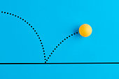 istock Bouncing table tennis ball is on blue background. 1315549434