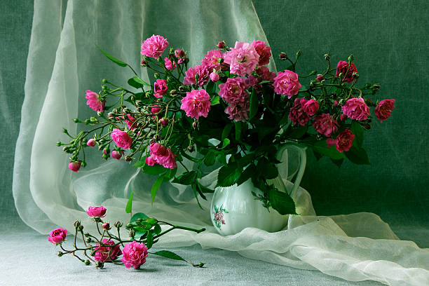 Bouquet of small roses in a vase.. stock photo