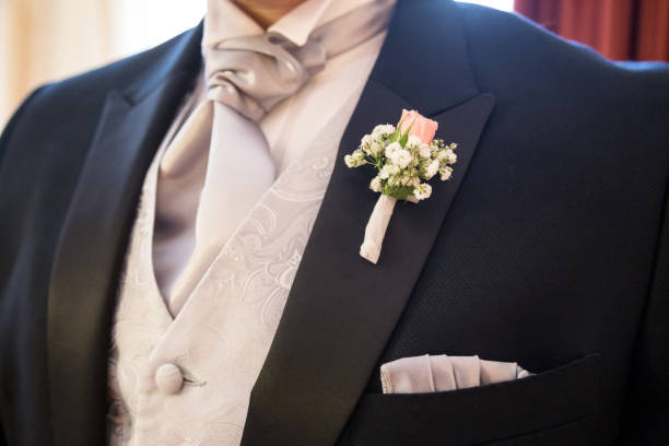 boutonniere in tuxedo stock photo
