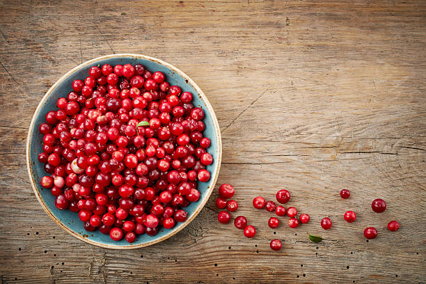 bowl of cowberries stock photo