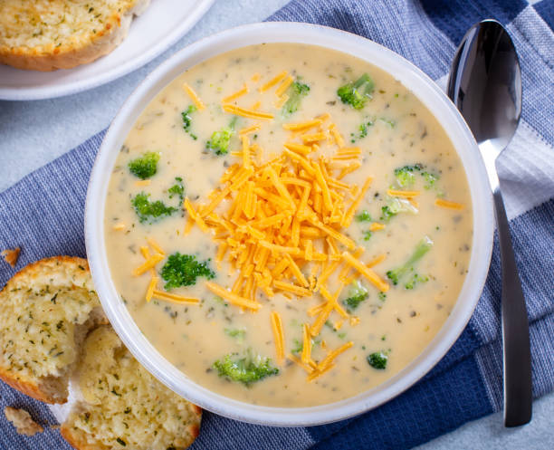 Bowl of Creamy Broccoli Cheddar Cheese Soup stock photo