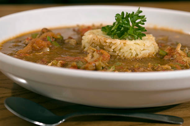 bowl of gumbo A bowl of gumbo with rice. gumbo stock pictures, royalty-free photos & images
