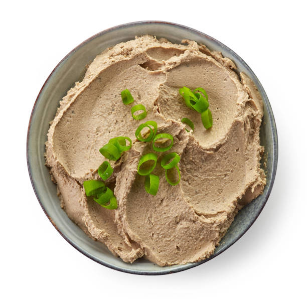 Bowl of homemade liver pate Bowl of homemade liver pate isolated on white background, top view pate photos stock pictures, royalty-free photos & images