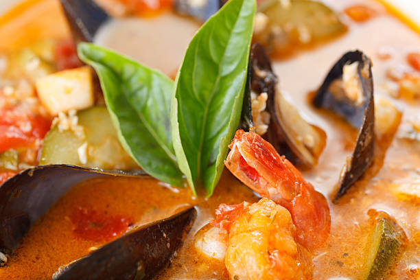 Bowl of Mussel, Shrimp and Scallop Soup stock photo