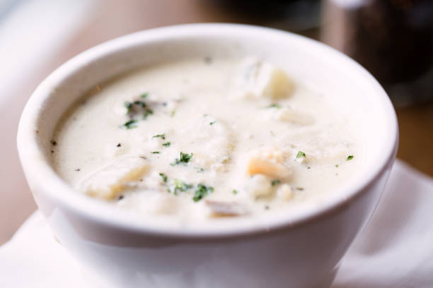 Bowl of New England clam chowder creamy bowl of New England clam chowder, Wellfleet MA, USA new england usa stock pictures, royalty-free photos & images