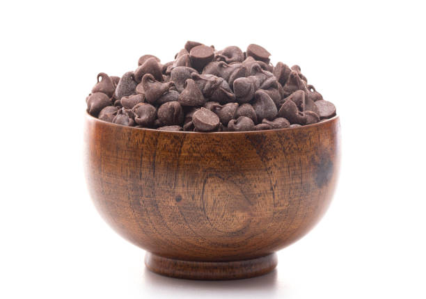 A Bowl of Semi Sweet Chocolate Baking Chips A Bowl of Semi Sweet Chocolate Baking Chips semi sweet chocolate stock pictures, royalty-free photos & images
