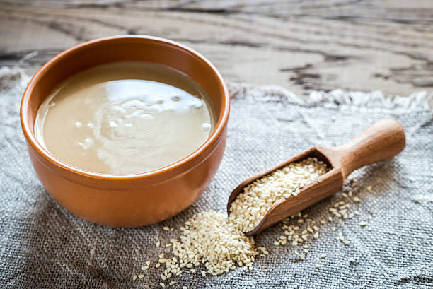 Bowl of tahini with sesame seeds  sesame stock pictures, royalty-free photos & images