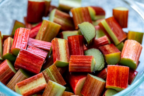 A bowl of uncooked chopped rhubarb stock photo