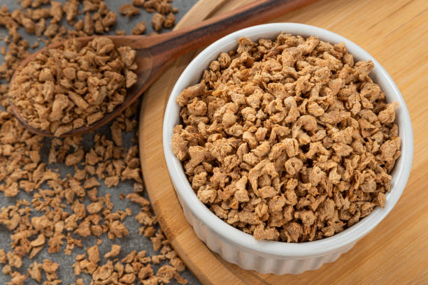 Bowl with soy protein grains. stock photo