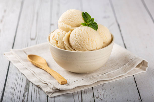 bowl with vanilla ice cream balls. - strawberry ice cream imagens e fotografias de stock