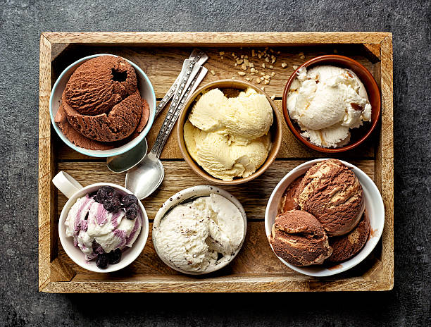 schüsseln mit verschiedenen eiscremes - ice cream fancy stock-fotos und bilder