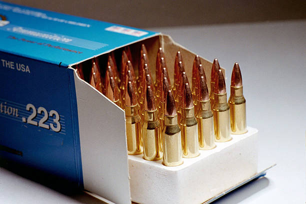 Box of .223 Ammunition "An open box of .223 caliber ammunition, same type used in M-16 and AR-15 rifles." ammunition stock pictures, royalty-free photos & images