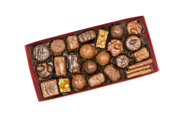 Box of assorted chocolate candies, view from above, isolated on white background with clipping path stock photo