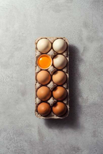 Box of eggs on grey background stock photo