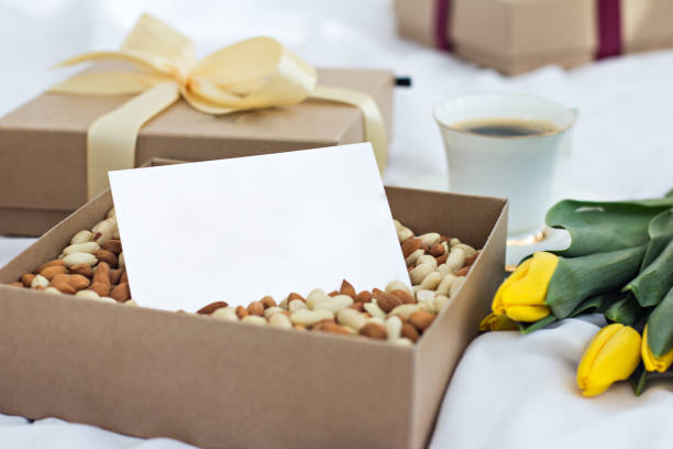 A box of nuts and a greeting card. card for text, gift stock photo