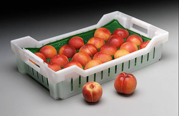 box of peaches stock photo