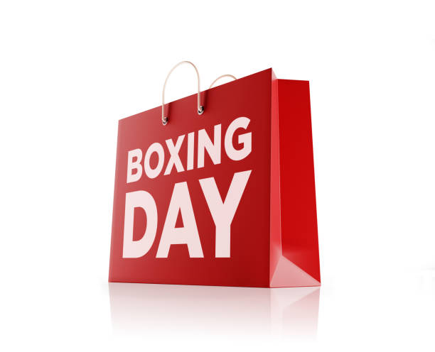 Red shopping bag isolated on white background. Boxing day writes on shopping bag. Horizontal composition with copy space and clipping path. Great use for shopping and Boxing day related concepts.