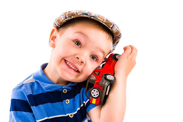 Boy and toy car stock photo