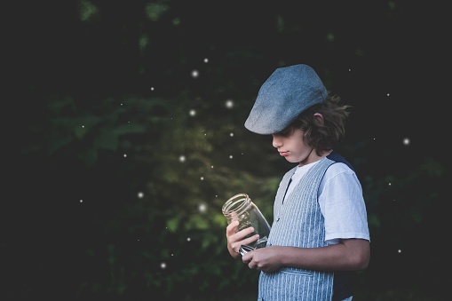 Young boy sad that he hasn’t caught any fireflies