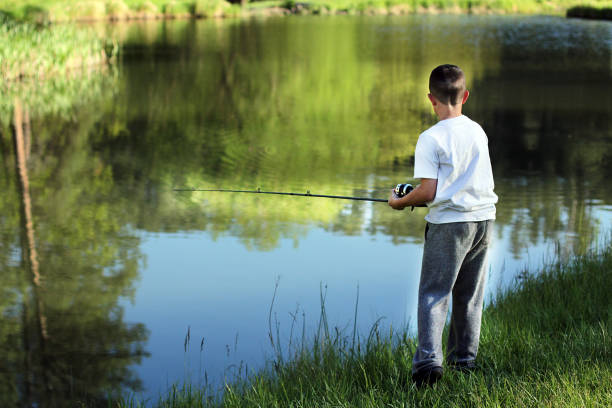 Best Boy Fishing Stock Photos, Pictures & Royalty-Free Images - iStock