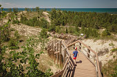 istock Boy hiking along dune succession trail in Indiana Dunes National Park 1325469383