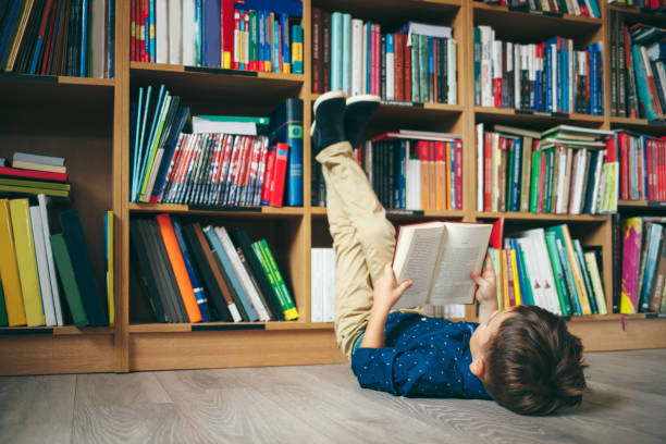 Boy in library stock photo