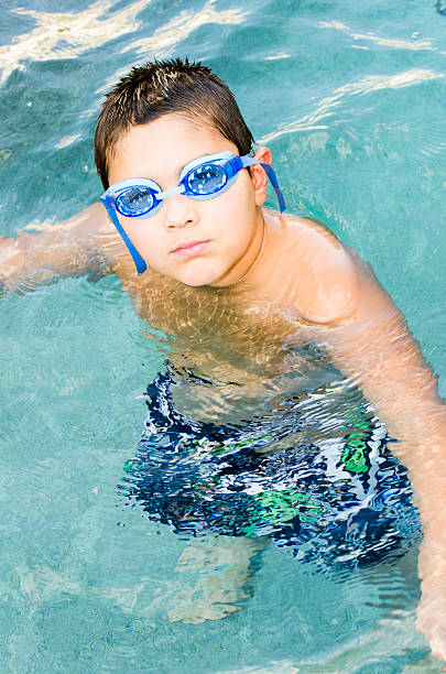Boy Wearing Blue Goggles In The Swimming Pool Stock Photo 