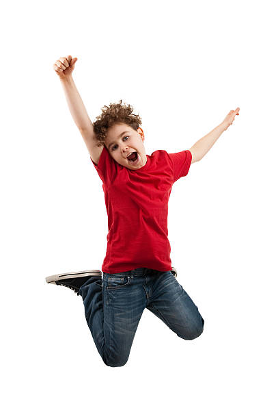 Boy jumping isolated on white background Active boy jumping  boy jumping stock pictures, royalty-free photos & images