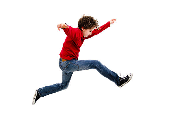 Boy jumping isolated on white background Boy jumping - studio shot boy jumping stock pictures, royalty-free photos & images