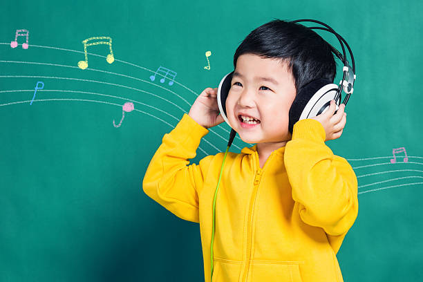 Boy Listening to Music Headphones stock photo