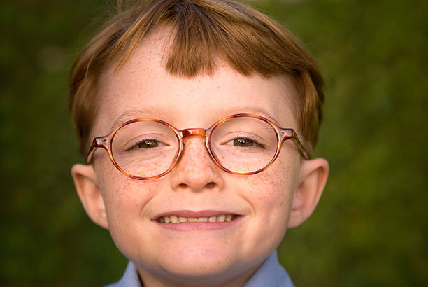 мальчик зануда с очки - nerd freckle glasses red hair стоковые фото и изобр...