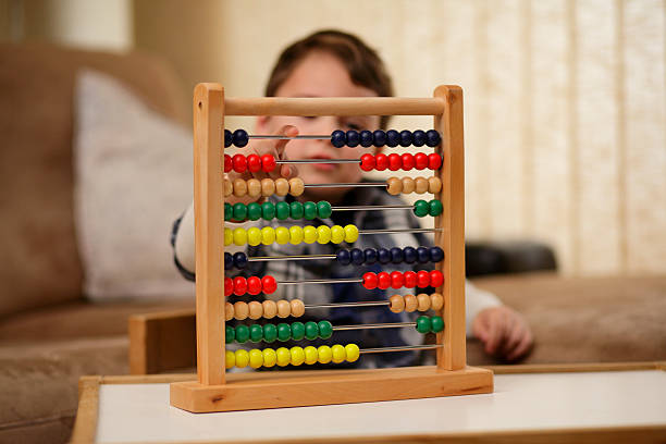 Boy playing with an abacus stock photo