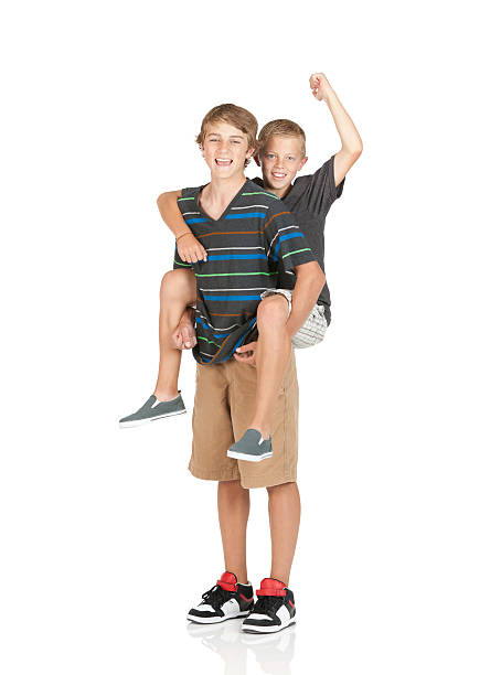 boy riding piggyback on his brother shoulders - piggyback sibling child tee...