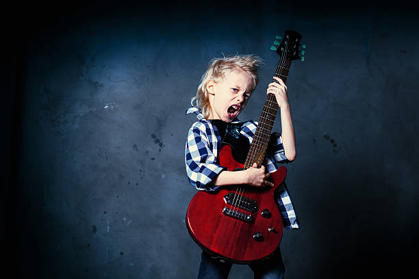 boy rock musician stock photo