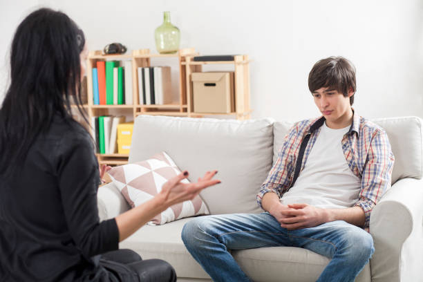 Boy teenager at a psychologist stock photo