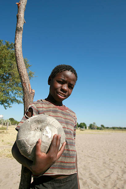 Boy with a soccer ball stock photo
