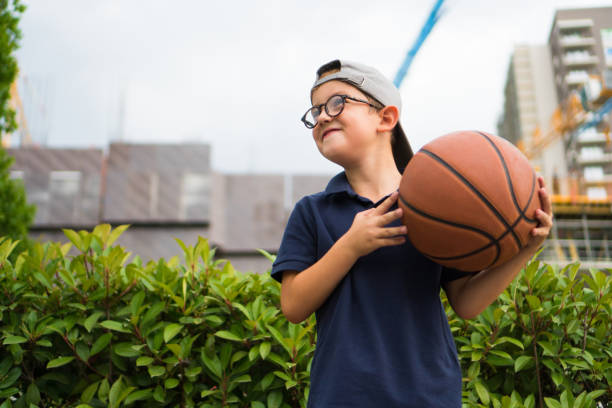 A boy with basketball stock photo