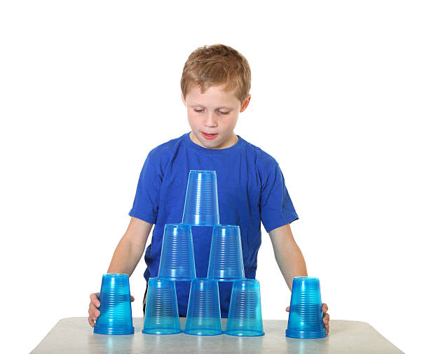 boy with cups stock photo