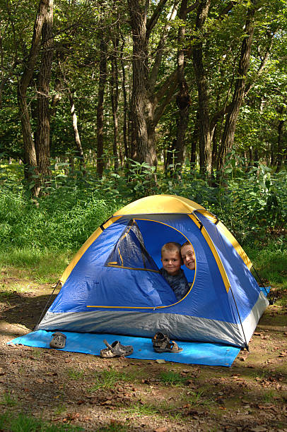 boys in a tent stock photo