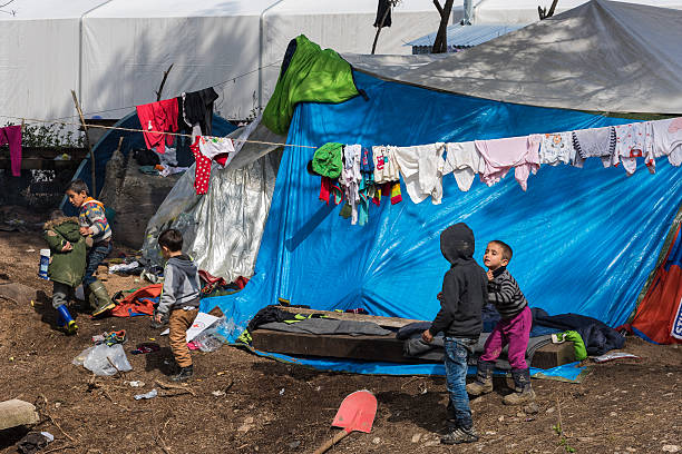 Boys in refugee camp in Greece stock photo