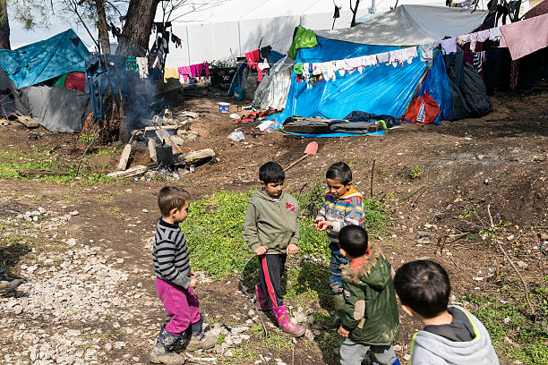 Boys in refugee camp of Idomeni, Greece stock photo