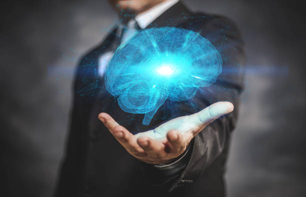 brain with businessman on his hand. stock photo